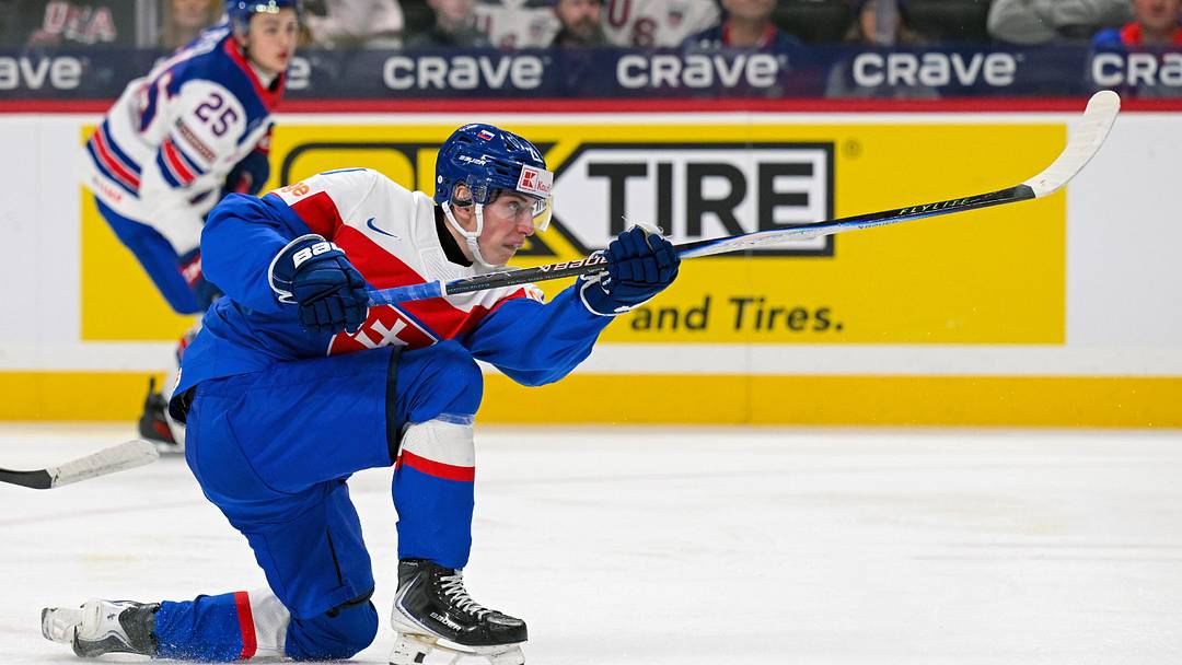 Dec 29, 2025; St. Paul, Minnesota, USA; Slovakia forward Adam Nemec (21) shoots the puck against USA during the second period of Group A play in the 2026 IIHF World Junior Championship at Grand Casino Arena. Mandatory Credit: Nick Wosika-Imagn Images