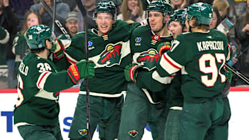 Apr 9, 2025; Saint Paul, Minnesota, USA;  Minnesota Wild forward Joel Eriksson Ek (14) celebrates with forward Mats Zuccarello (36), forward Joel Eriksson Ek (14), forward Marco Rossi (23) and forward Kiril Kaprizov (97) after completing a hat trick on a power play goal against the San Jose Sharks during the third period at Xcel Energy Center. Mandatory Credit: Nick Wosika-Imagn Images