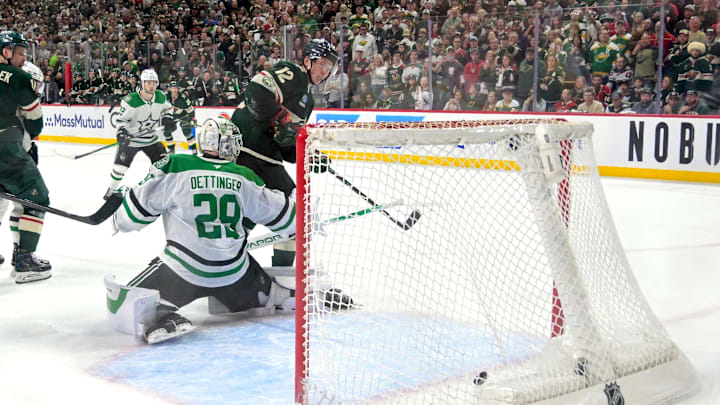 Apr 25, 2026; Saint Paul, Minnesota, USA; Minnesota Wild forward Matt Boldy (12) redirects a shot past Dallas Stars goalie Jake Oettinger (29) for the game-winning goal during overtime in game four of the first round of the 2026 Stanley Cup Playoffs at Grand Casino Arena. Mandatory Credit: Nick Wosika-Imagn Images