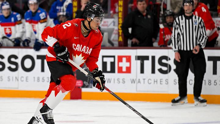 Jan 2, 2026; Minneapolis, Minnesota, USA; Canada defensemen Kashawn Aitcheson (2) controls the puck against Slovakia during the second period in the quarterfinals of the 2026 IIHF World Junior Championship at 3M Arena. Mandatory Credit: Nick Wosika-Imagn Images Jan 2, 2026; Minneapolis, Minnesota, USA; Canada defensemen Kashawn Aitcheson (2) controls the puck against Slovakia during the second period in the quarterfinals of the 2026 IIHF World Junior Championship at 3M Arena. Mandatory Credit: Nick Wosika-Imagn Images