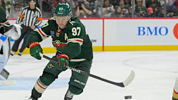 Dec 15, 2024; Saint Paul, Minnesota, USA;  Minnesota Wild forward Kirill Kaprizov (97) makes a pass against The Vegas Golden Knights during the third period at Xcel Energy Center. Mandatory Credit: Nick Wosika-Imagn Images