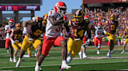 Sep 27, 2025; Minneapolis, Minnesota, USA;  Rutgers Scarlet Knights running back Antwan Raymond (3) runs with the ball as Minnesota Golden Gophers linebacker Devon Williams (9) and defensive back Kerry Brown (14) give chase during the fourth quarter at Huntington Bank Stadium.