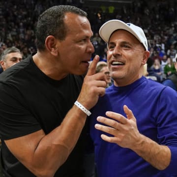 Apr 12, 2022; Minneapolis, Minnesota, USA;  Minnesota Timberwolves co-minority owners Alex Rodriguez and Marc Lore celebrate a victory over the Los Angeles Clippers after a play-in game at Target Center.