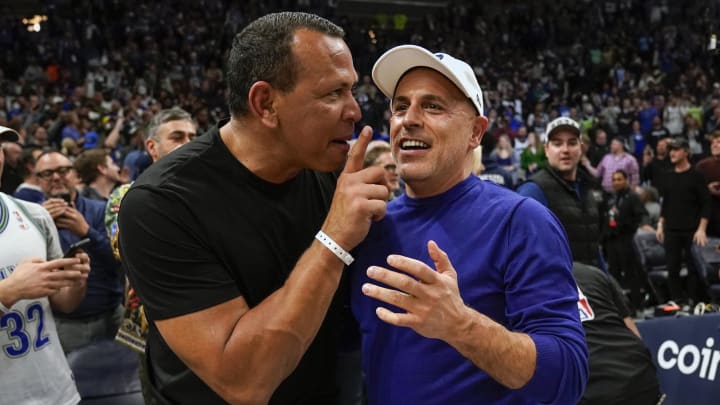 Apr 12, 2022; Minneapolis, Minnesota, USA;  Minnesota Timberwolves co-minority owners Alex Rodriguez and Marc Lore celebrate a victory over the Los Angeles Clippers after a play-in game at Target Center.