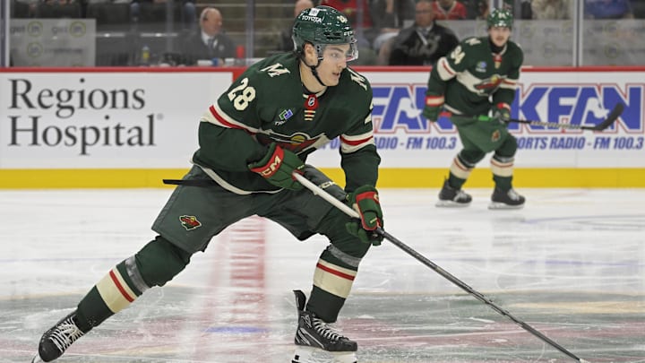 Sep 29, 2024; Saint Paul, Minnesota, USA;  Minnesota Wild forward Liam Ohgren (28) skates with the puck during the third period at Xcel Energy Center. Mandatory Credit: Nick Wosika-Imagn Images