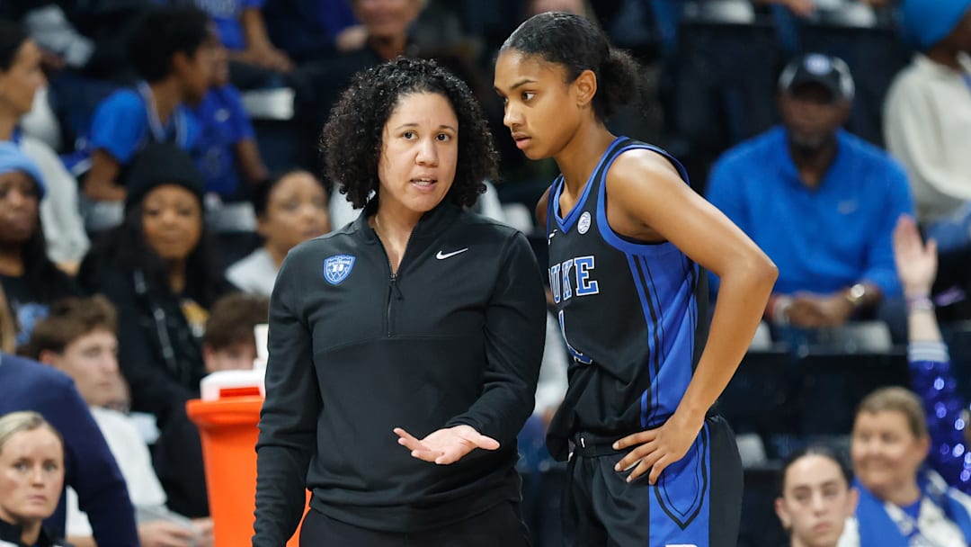 After Duke started the season ranked at No. 7, Kara Lawson (left) has seen her Blue Devils quickly tumble out of the Top 25. 