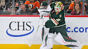 Nov 15, 2025; Saint Paul, Minnesota, USA;  Minnesota Wild goalie Jesper Wallstedt (30) makes a pass against the Anaheim Ducks during the first period at Grand Casino Arena. Mandatory Credit: Nick Wosika-Imagn Images