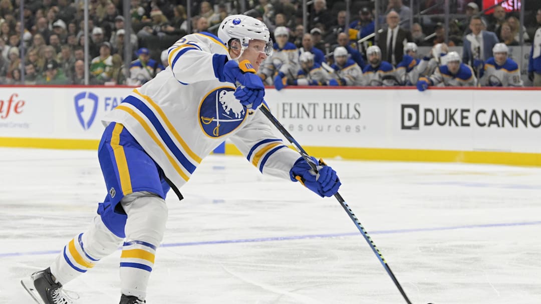 Mar 22, 2025; Saint Paul, Minnesota, USA;  Buffalo Sabres defenseman Rasmus Dahlin (26) takes a shot on goal against the Minnesota Wild during the first period at Xcel Energy Center. Mandatory Credit: Nick Wosika-Imagn Images