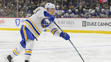 Mar 22, 2025; Saint Paul, Minnesota, USA;  Buffalo Sabres defenseman Rasmus Dahlin (26) takes a shot on goal against the Minnesota Wild during the first period at Xcel Energy Center. Mandatory Credit: Nick Wosika-Imagn Images