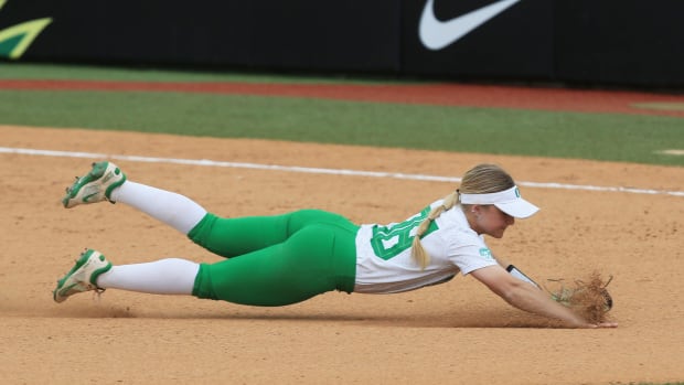 Oregon's Paige Sinicki dives for a ball during the game against Utah Sunday, May 7, 2023.