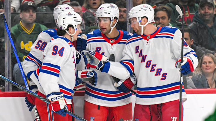 Mar 14, 2026; Saint Paul, Minnesota, USA;  New York Rangers forward Noah Laba (42) celebrates his power play goal against the Minnesota Wild with forward Gabe Perreault (94), forward Will Cuylle (50), and defensemen Vladislav Gavrikov (44) during the first period at Grand Casino Arena. 