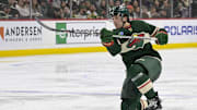 Mar 14, 2024; Saint Paul, Minnesota, USA; Minnesota Wild defenseman Brock Faber (7) takes a shot on goal against the Anaheim Ducks during the second period at Xcel Energy Center. Mandatory Credit: Nick Wosika-Imagn Images