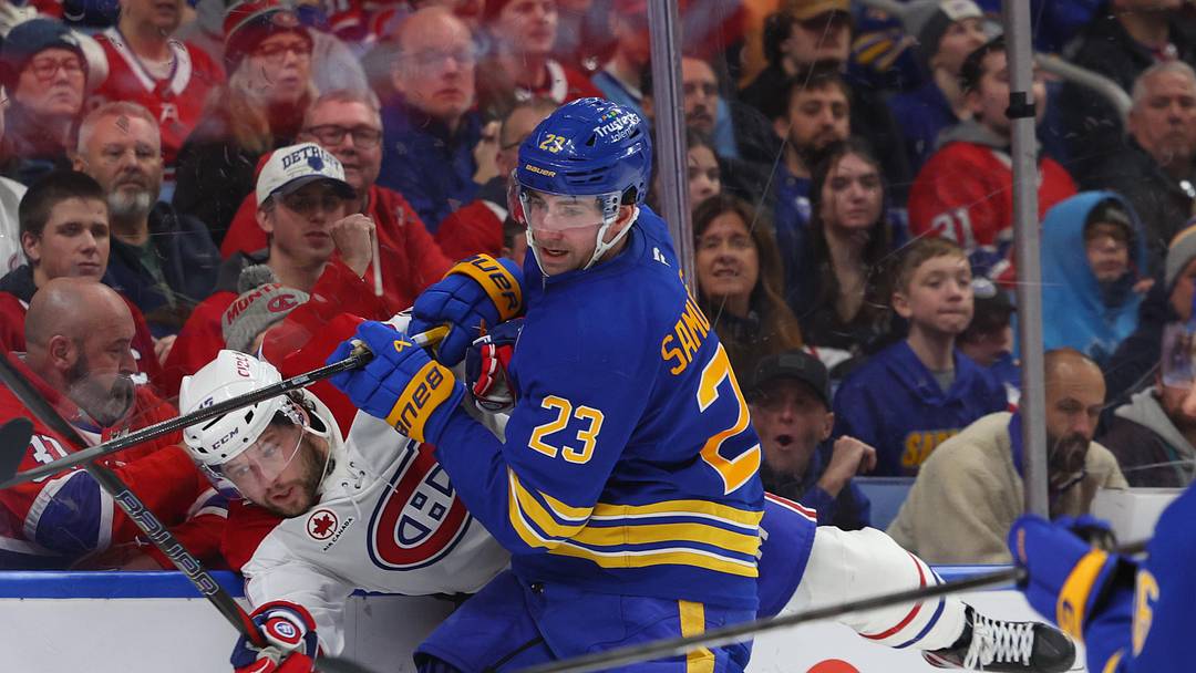 Jan 31, 2026; Buffalo, New York, USA;  Buffalo Sabres defenseman Mattias Samuelsson (23) checks Montréal Canadiens right wing Josh Anderson (17) as they go after a loose puck during the third period at KeyBank Center. Mandatory Credit: Timothy T. Ludwig-Imagn Images