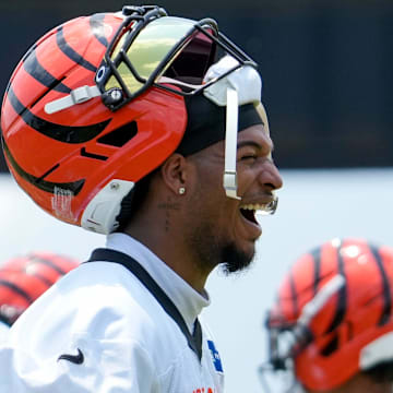 Cincinnati Bengals wide receiver Ja'Marr Chase (1) laughs between plays during a session of organized team activities on the Bengals practice field at Paycor Stadium in downtown Cincinnati on Tuesday, June 3, 2025.