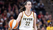 Jul 9, 2025; Indianapolis, Indiana, USA; Indiana Fever guard Caitlin Clark (22) dibbles in the first half against Golden State Valkyries at Gainbridge Fieldhouse. Mandatory Credit: Trevor Ruszkowski-Imagn Images