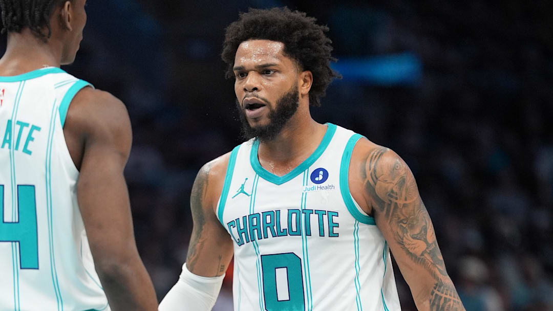 Apr 14, 2026; Charlotte, North Carolina, USA; Charlotte Hornets forward Miles Bridges (0) fist pumps with forward Moussa Diabaté (14) during the first quarter during the play-in rounds between the Charlotte Hornets and the Miami Heat of the 2026 NBA Playoffs at Spectrum Center. Mandatory Credit: Jim Dedmon-Imagn Images