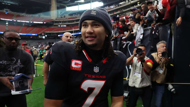 Dec 14, 2025; Houston, Texas, USA; Houston Texans quarterback C.J. Stroud (7) throws armbands to fans following a win over the Arizona Cardinals at NRG Stadium. Mandatory Credit: Thomas Shea-Imagn Images