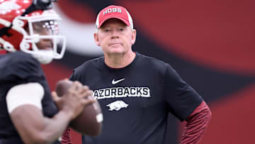 Arkansas Razorbacks offensive coordinator and quarterbacks coach Bobby Petrino watches quarterback KJ Jackson (7) during practice on the indoor practice field in Fayetteville, Ark.