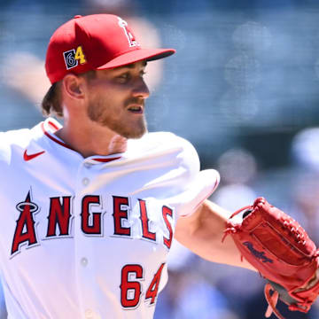 Aug 18, 2024; Anaheim, California, USA; Los Angeles Angels pitcher Jack Kochanowicz (64) throws a pitch against the Atlanta Braves during the first inning at Angel Stadium. 