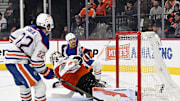 Nov 12, 2025; Philadelphia, Pennsylvania, USA; Edmonton Oilers center Jack Roslovic (28) scores the game winning goal in overtime past Philadelphia Flyers goaltender Dan Vladar (80) at Xfinity Mobile Arena. Mandatory Credit: Eric Hartline-Imagn Images