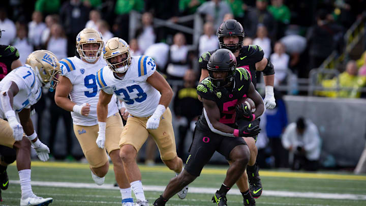 Oregon running back Sean Dollars carries the ball for the Ducks as the Oregon Ducks take on the UCLA Bruins Saturday, Oct. 22, 2022, at Autzen Stadium in Eugene, Ore.