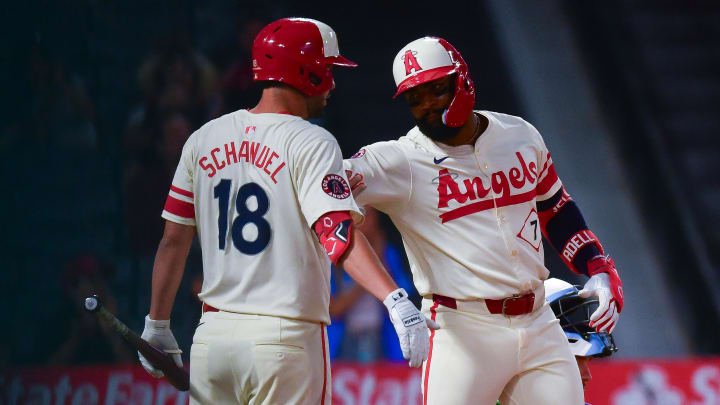 Aug 12, 2024; Anaheim, California, USA; Los Angeles Angels right fielder Jo Adell (7) is greeted by first baseman Nolan Schanuel (18) after hitting a solo home run against the Toronto Blue Jays during the ninth inning at Angel Stadium. Mandatory Credit: Gary A. Vasquez-USA TODAY Sports