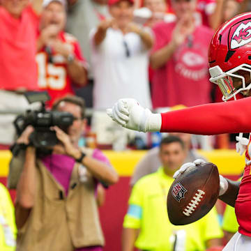 Sep 15, 2024; Kansas City, Missouri, USA; Kansas City Chiefs offensive tackle Wanya Morris (64) celebrates after scoring a touchdown during the second half against the Cincinnati Bengals at GEHA Field at Arrowhead Stadium. Mandatory Credit: Jay Biggerstaff-Imagn Images