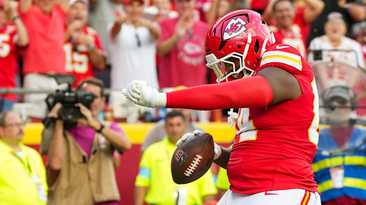 Sep 15, 2024; Kansas City, Missouri, USA; Kansas City Chiefs offensive tackle Wanya Morris (64) celebrates after scoring a touchdown during the second half against the Cincinnati Bengals at GEHA Field at Arrowhead Stadium. Mandatory Credit: Jay Biggerstaff-Imagn Images