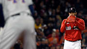 Oct 18, 2021; Boston, Massachusetts, USA; Boston Red Sox starting pitcher Eduardo Rodriguez (57) watches Houston Astros designated hitter Yordan Alvarez (44) on first base during the fourth inning of game three of the 2021 ALCS at Fenway Park. 