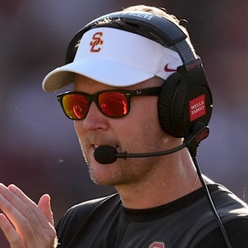 Aug 30, 2025; Los Angeles, California, USA; Southern California Trojans head coach Lincoln Riley watches from the sidelines against the Missouri State Bears in the first half at United Airlines Field at Los Angeles Memorial Coliseum. Mandatory Credit: Kirby Lee-Imagn Images