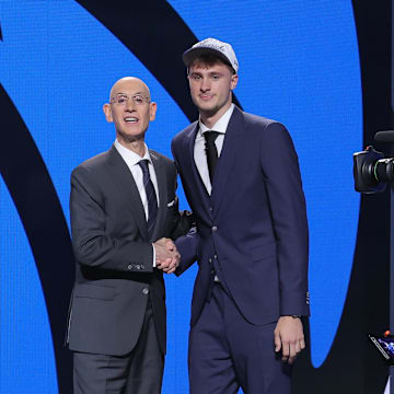 Jun 25, 2025; Brooklyn, NY, USA;  Cooper Flagg poses with NBA commissioner Adam Silver after being selected as first overall by the Dallas Mavericks in the first round of the 2025 NBA Draft at Barclays Center. Mandatory Credit: Brad Penner-Imagn Images