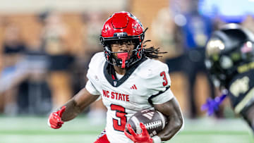 Sep 11, 2025; Winston-Salem, North Carolina, USA;  North Carolina State Wolfpack running back Hollywood Smothers (3) runs the ball in the first half against the Wake Forest Demon Deacons at Allegacy Federal Credit Union Stadium. Mandatory Credit: Luke Jamroz-Imagn Images