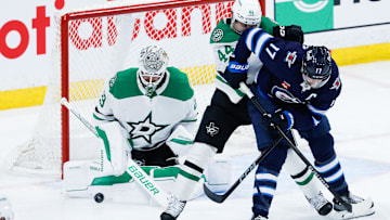 May 7, 2025; Winnipeg, Manitoba, CAN; Dallas Stars goalie Jake Oettinger (29) makes a save against the Winnipeg Jets during the third period in game one of the second round of the 2025 Stanley Cup Playoffs at Canada Life Centre. Mandatory Credit: Terrence Lee-Imagn Images
