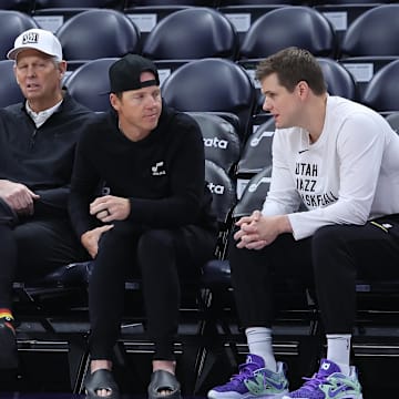 Feb 6, 2024; Salt Lake City, Utah, USA; From left to right, Utah Jazz general manager Justin Zanik, CEO Danny Ainge, owner Ryan Smith and head coach Will Hardy sit court side before the game between the Utah Jazz and the Oklahoma City Thunder at Delta Center. Mandatory Credit: Rob Gray-Imagn Images