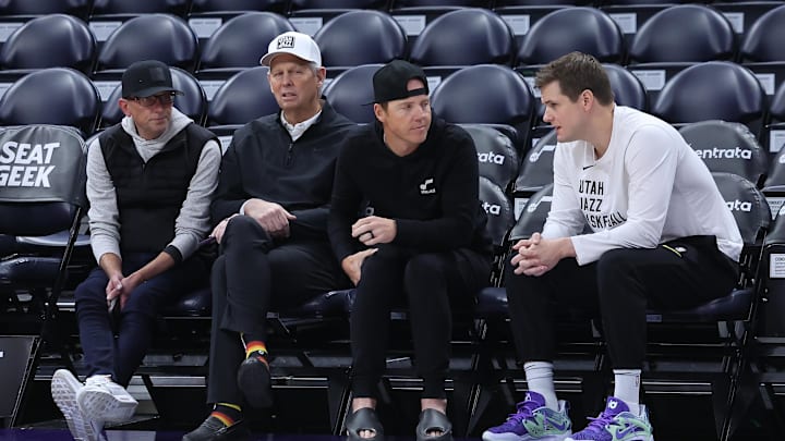 Feb 6, 2024; Salt Lake City, Utah, USA; From left to right, Utah Jazz general manager Justin Zanik, CEO Danny Ainge, owner Ryan Smith and head coach Will Hardy sit court side before the game between the Utah Jazz and the Oklahoma City Thunder at Delta Center. Mandatory Credit: Rob Gray-Imagn Images