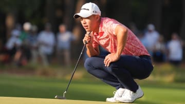 Collin Morikawa lines up a putt at the U.S. Open