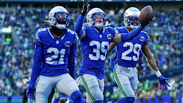 Nov 30, 2025; Seattle, Washington, USA; Seattle Seahawks safety Ty Okada (39) celebrates after retrieving a fumble during the second half against the Minnesota Vikings at Lumen Field. Mandatory Credit: Kevin Ng-Imagn Images