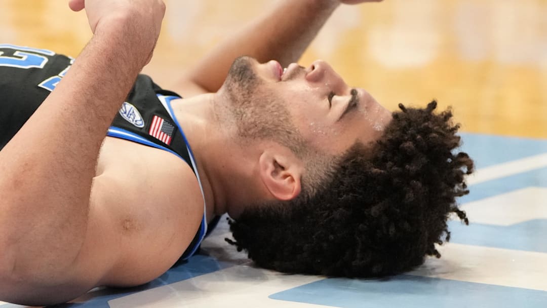 Feb 7, 2026; Chapel Hill, North Carolina, USA; Duke Blue Devils forward Cameron Boozer (12) on the floor in the second  half at Dean E. Smith Center. Mandatory Credit: Bob Donnan-Imagn Images