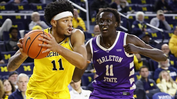 Nov 21, 2024; Ann Arbor, Michigan, USA;  Michigan Wolverines guard Roddy Gayle Jr. (11) dribbles defended by Tarleton Texans guard Bubu Benjamin (11) in the first half at Crisler Center. Mandatory Credit: Rick Osentoski-Imagn Images