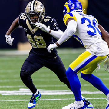 Dec 1, 2024; New Orleans, Louisiana, USA;  New Orleans Saints safety J.T. Gray (48) and New Orleans Saints safety Roderic Teamer (30) run downfildagainst the hduring the second half at Caesars Superdome. Mandatory Credit: Stephen Lew-Imagn Images