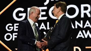 Jun 28, 2023; Nashville, Tennessee, USA; Dallas Stars general manager Jim Nill is awarded the Jim Gregory General Manager of the Year award by Nashville Predators general manager David Poile during the first round of the 2023 NHL Draft at Bridgestone Arena. Mandatory Credit: Christopher Hanewinckel-Imagn Images
