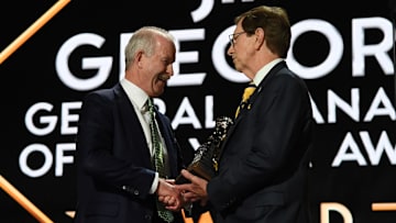 Jun 28, 2023; Nashville, Tennessee, USA; Dallas Stars general manager Jim Nill is awarded the Jim Gregory General Manager of the Year award by Nashville Predators general manager David Poile during the first round of the 2023 NHL Draft at Bridgestone Arena. Mandatory Credit: Christopher Hanewinckel-Imagn Images