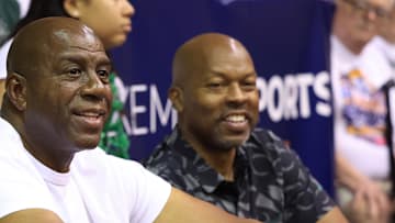 Nov 25, 2024; Lahaina, Hawaii, USA;  Former professional basketball player and Michigan State alumni, Earving “Magic” Johnson, center, watches the Colorado Buffaloes take on the Michigan State Spartans in the first half of an NCAA college basketball game at Lahaina Civic Center.