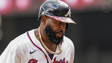Atlanta Braves designated hitter Marcell Ozuna (20) reacts after hitting a home run against the Washington Nationals during the eighth inning at Truist Park.