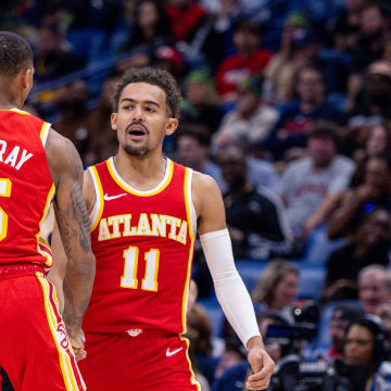 Nov 4, 2023; New Orleans, Louisiana, USA;  Atlanta Hawks guard Trae Young (11) slaps hands with guard Dejounte Murray (5) after he makes a basket against the New Orleans Pelicans during the second half at Smoothie King Center. Mandatory Credit: Stephen Lew-USA TODAY Sports