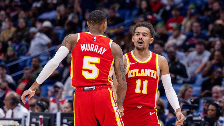 Nov 4, 2023; New Orleans, Louisiana, USA;  Atlanta Hawks guard Trae Young (11) slaps hands with guard Dejounte Murray (5) after he makes a basket against the New Orleans Pelicans during the second half at Smoothie King Center. Mandatory Credit: Stephen Lew-USA TODAY Sports