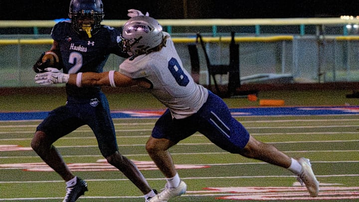 Chapin’s Corwon Martin is tackled by Franklin’s Joseuberto Bodoni-Guzman.