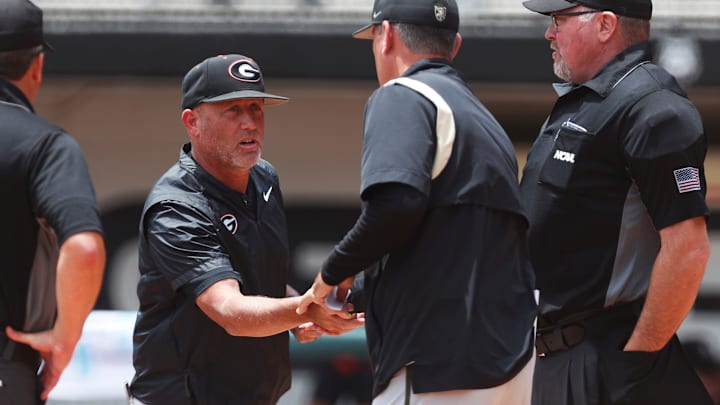 Georgia coach Wes Johnson shakes hand with Army coach Chris Tracz before a NCAA Athens Regional baseball game against Army in Athens, Ga., on Friday, May 31, 2024. Georgia won 8-7. Georgia coach Wes Johnson shakes hand with Army coach Chris Tracz before a NCAA Athens Regional baseball game against Army in Athens, Ga., on Friday, May 31, 2024. Georgia won 8-7.