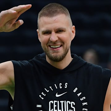 May 14, 2025; Boston, Massachusetts, USA; Boston Celtics center Kristaps Porzingis (8) reacts prior to game five of the second round for the 2025 NBA Playoffs against the New York Knicks at TD Garden. Mandatory Credit: Bob DeChiara-Imagn Images