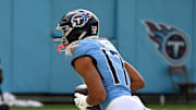 Tennessee Titans wide receiver Chimere Dike scores a touchdown against the New England Patriots.